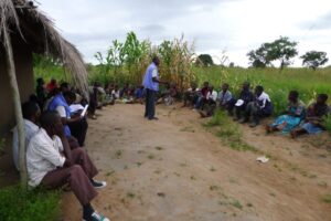 Working in a team of two, paralegals from PASI East conduct a sensitisation meeting