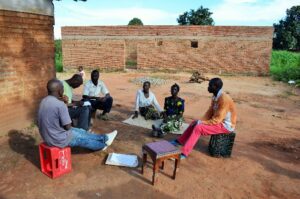 PASI paralegals conducting interviews with family members near Mzuzu