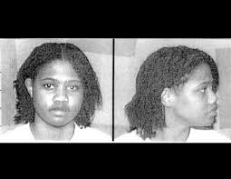 Two mug shots of a woman - one from the side, one from the front.